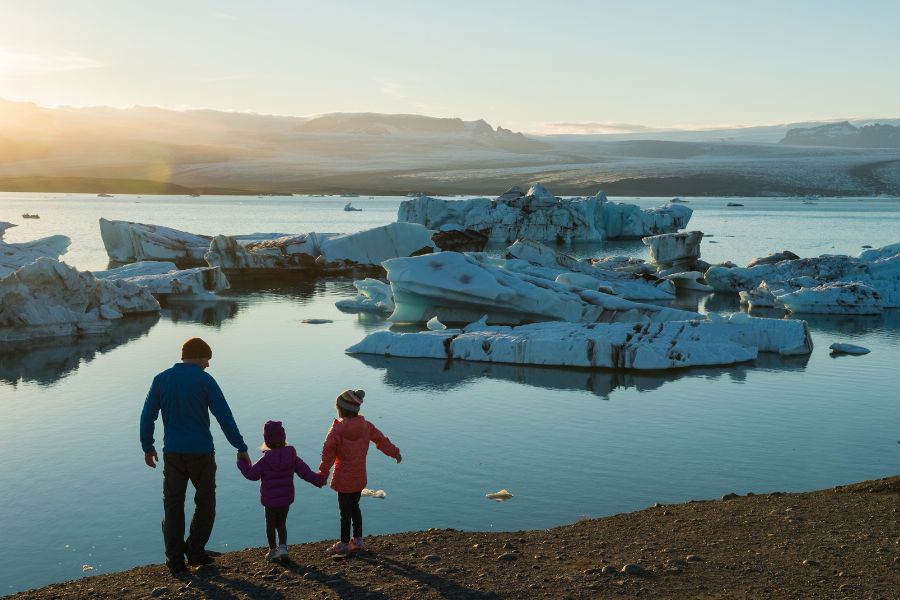 A family looking at icebergs in Iceland